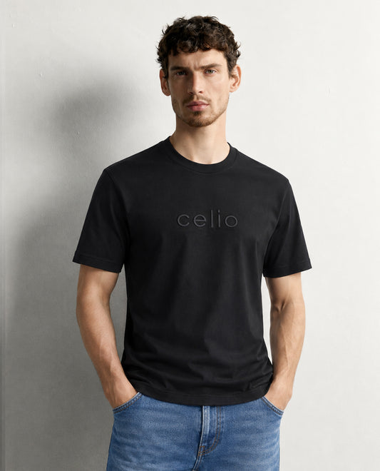 Black colour t shirt featuring round design neck, elegant Design body with a text, Half sleeve.