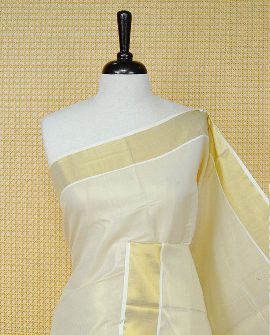 Cream Colour Tissue  Kerala Saree Featuring  Plain  Body, Enhanced With A Gold Zari  Border, A Traditional Gold Zari Pallu, And A Matching Blouse Piece.