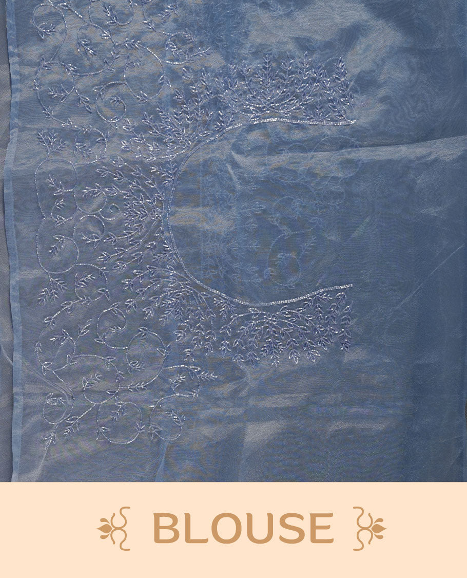 Blue colour Organza designer saree featuring a thread geometric pattern across the body, enhanced with a piping border and cut beats work on matching blouse piece.