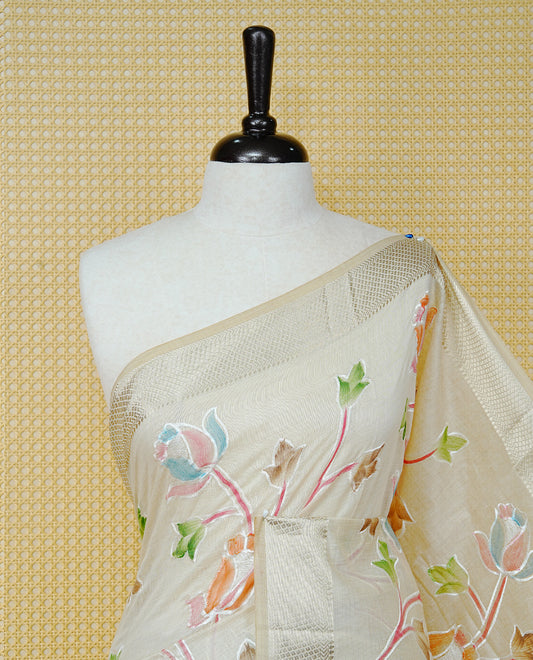 Cream Colour Tissue Kerala Saree Featuring Floral Kodi Threadwork Across The Body, Enhanced With A Light Gold Zari Border And A Peach Floral Pallu, Finished With Gold Tassels And A Matching Blouse Piece