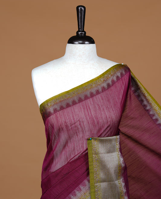 Grape colour Semi linen saree featuring Elegant plain body, complemented by contrast Green colour With Antique zari border, paired with matching blouse piece.