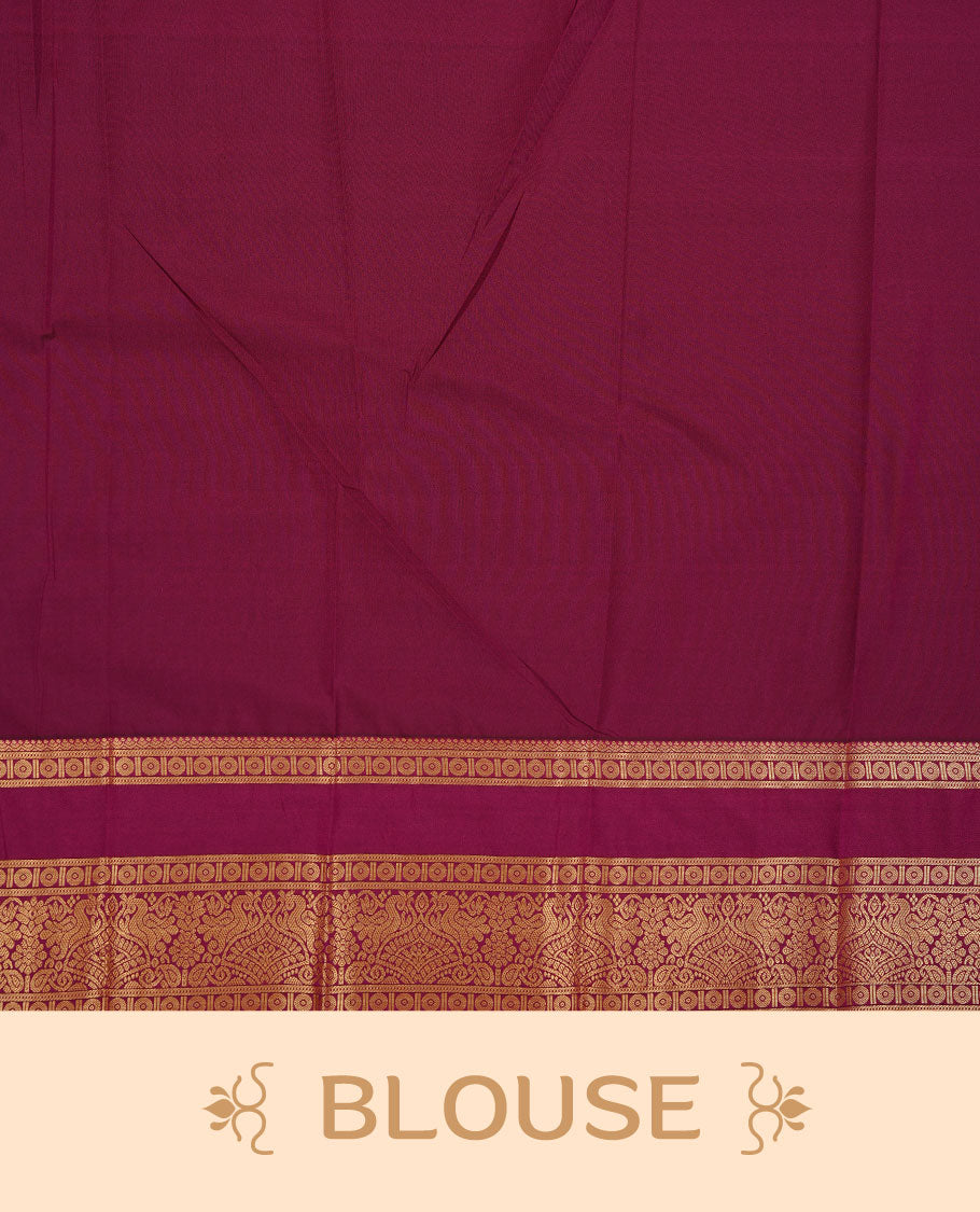 Magenta colour soft silk saree featuring Gold zari stripes on body, complemented by contrast purple colour with traditional border, paired with matching blouse piece.