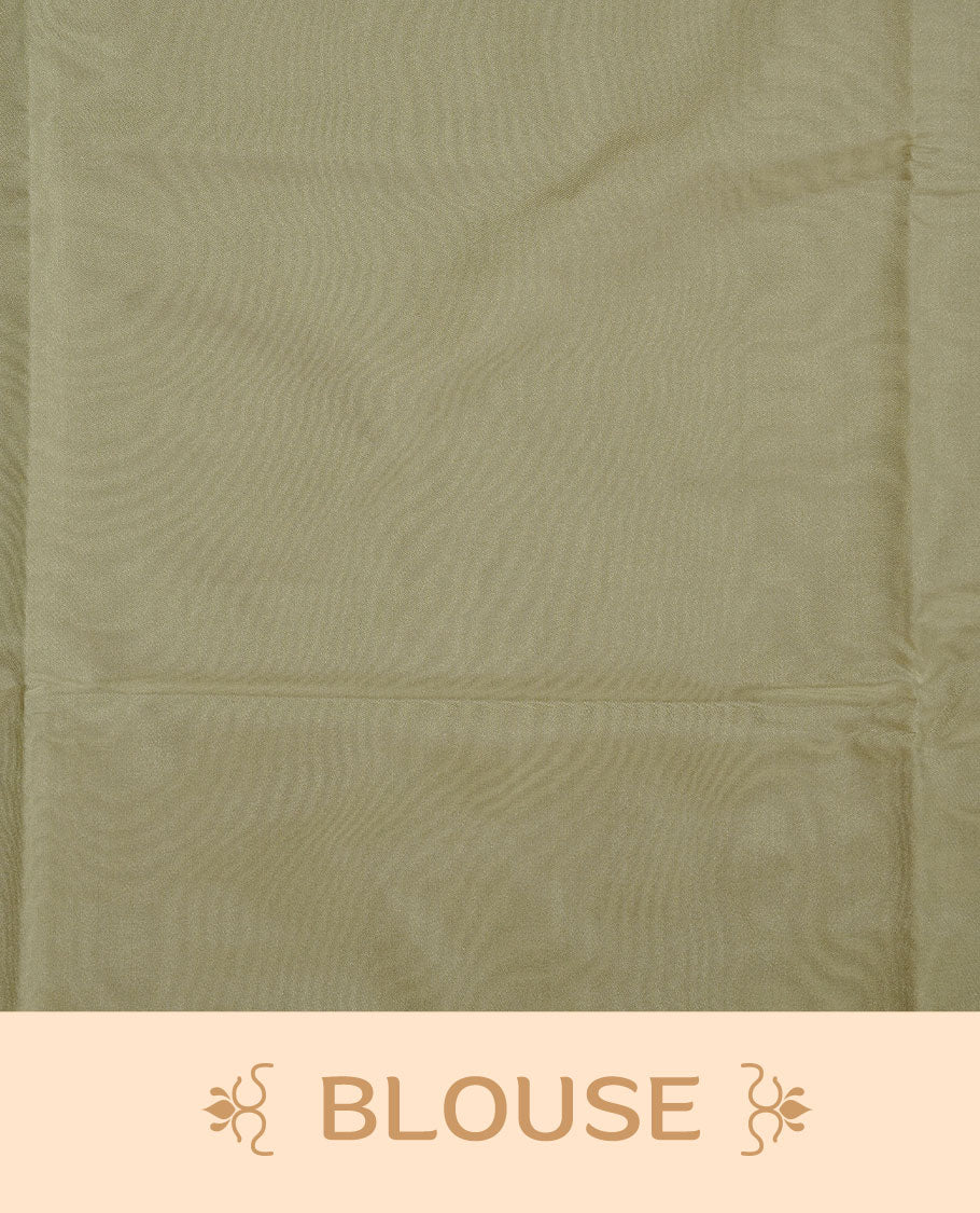 Tea green soft silk saree features a sleek borderless design with intricate antique zari motifs, flowing into a seamless self colored pallu and a matching blouse piece.