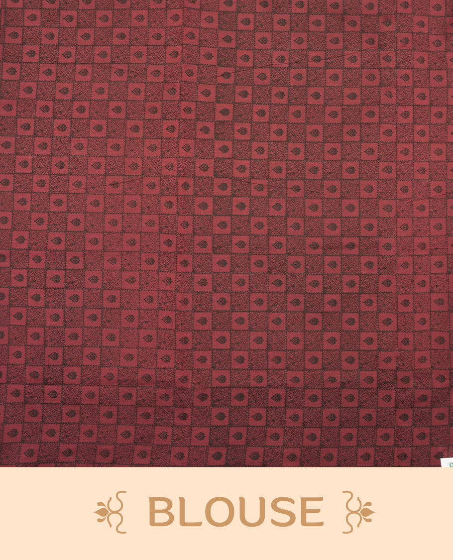 Dark Red colour poly cotton saree with black vertical dotted line pattern on the body, paired with a matching pallu featuring black zigzag geometric border, and a coordinated all‑over black stylised fleur‑de‑lis printed blouse piece.