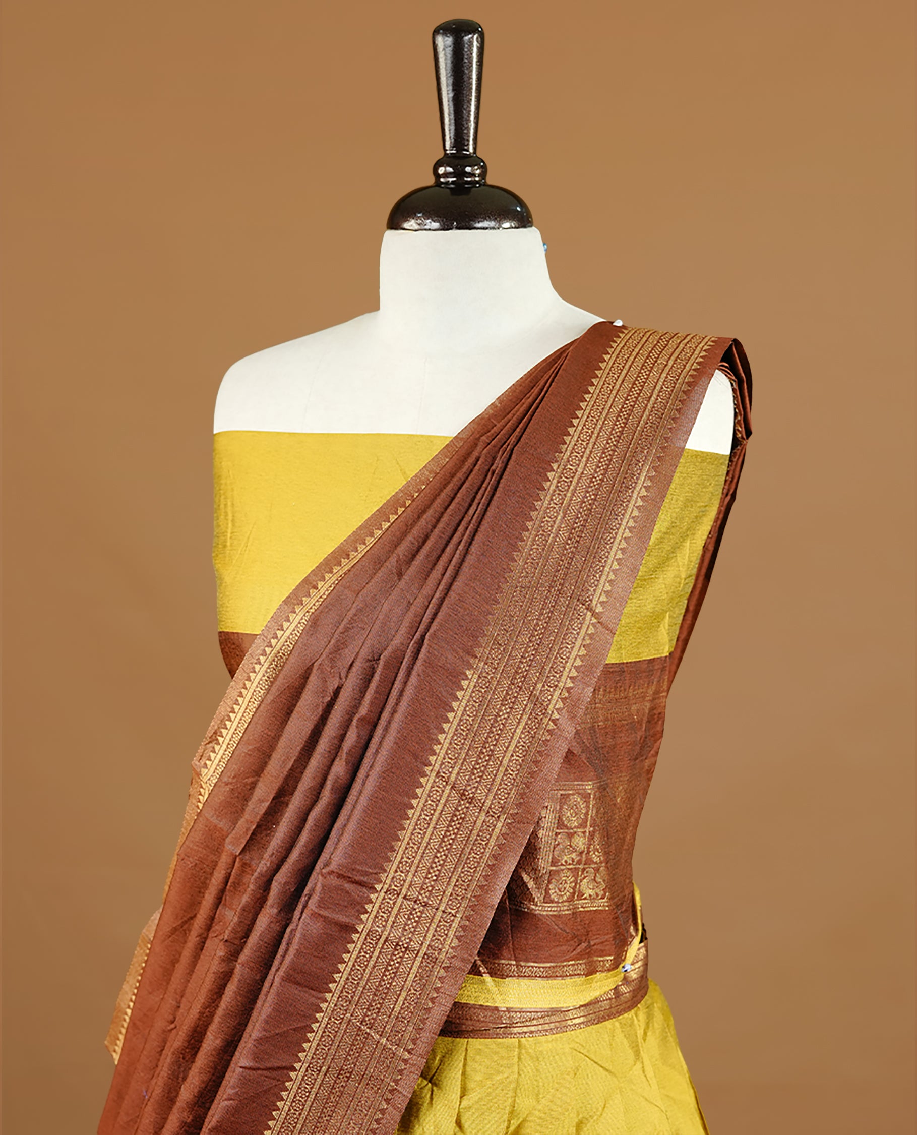 Olive colour semi stitched Half saree featuring contrast chocolate brown colour with gold zari traditional border skirt, paired with matching zari border dupatta, unstitched blouse piece