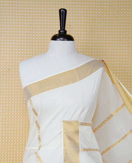 Cream Colour Cotton Kerala Saree Featuring an Elegant Plain Body, a Classy Gold Zari Border, and a Traditional Gold Zari Pallu with Orange Accents, Paired with a Matching Blouse Piece.
