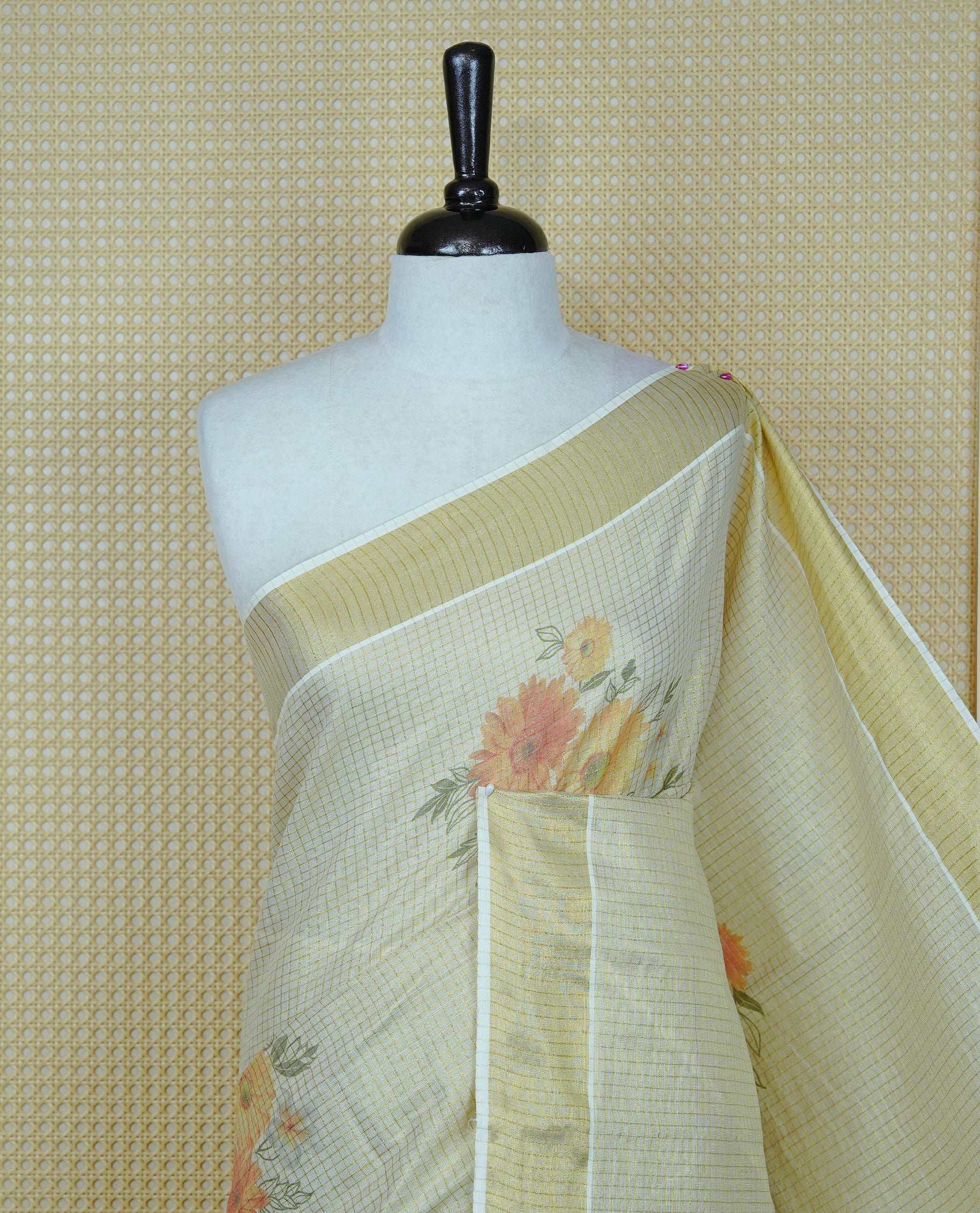 Light gold colour tissue Kerala saree featuring Floral print & Gold zari check on body, complemented by gold Border, comes with matching blouse piece.