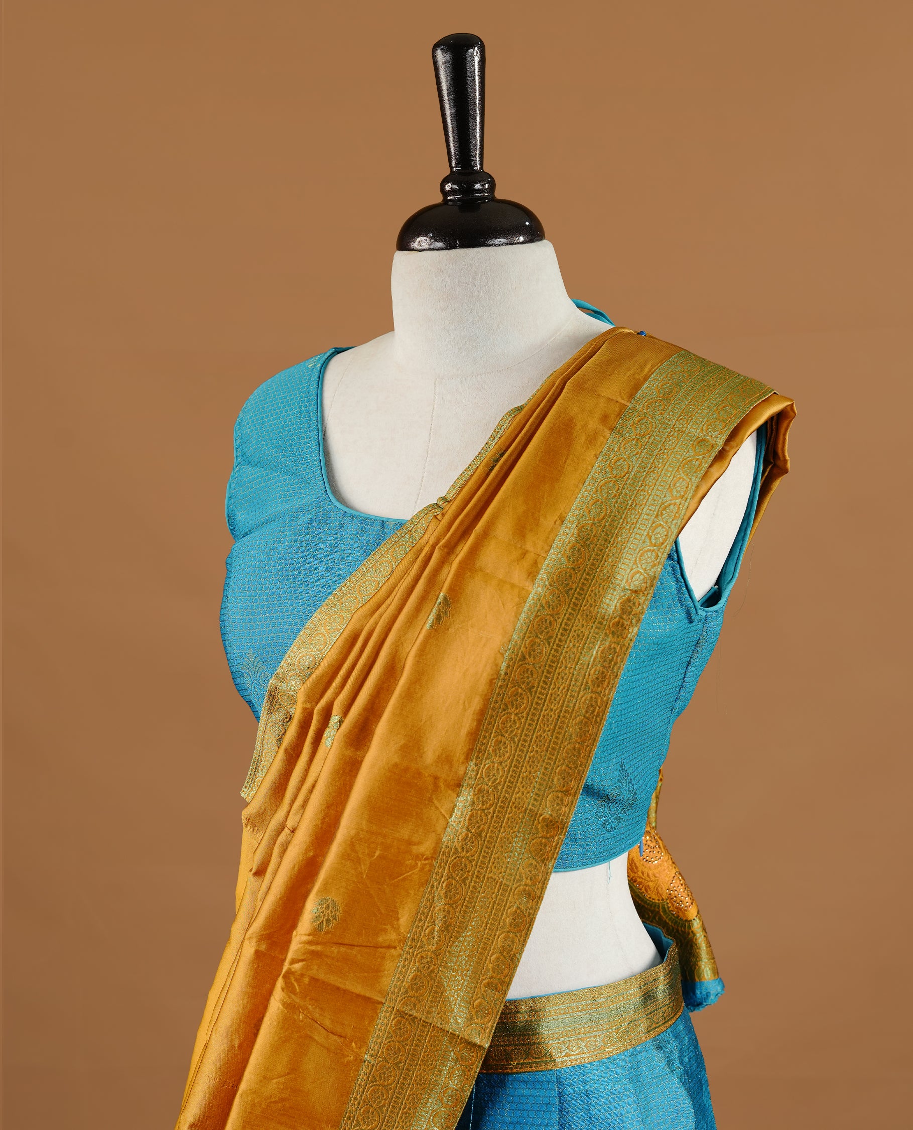 Blue colour Half saree featuring a blue colour skirt with contrast mustrad colour border with zari pattern,stone work, paired with matching dupatta, stitched blouse.