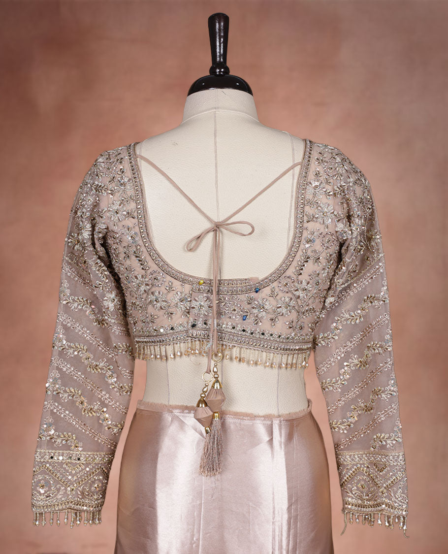 Beige Colour net designer Wedding saree featuring all over floral embroidery with sequin detailing and an ornate scalloped border, finished with a matching embellished blouse.