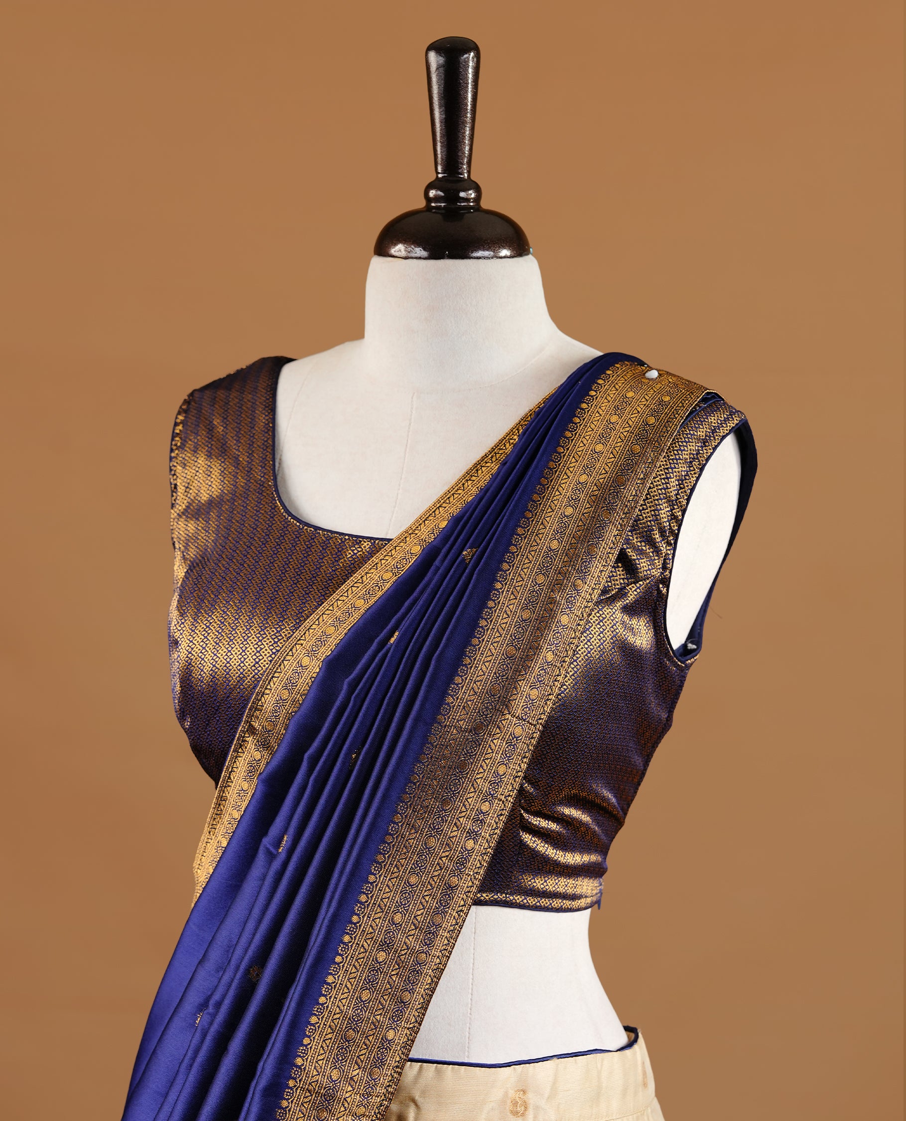 Gold and blue colour Half saree featuring gold colour skirt with contrast blue colour border with gold zari pattern, paired with matching dupatta and stitched blouse piece.