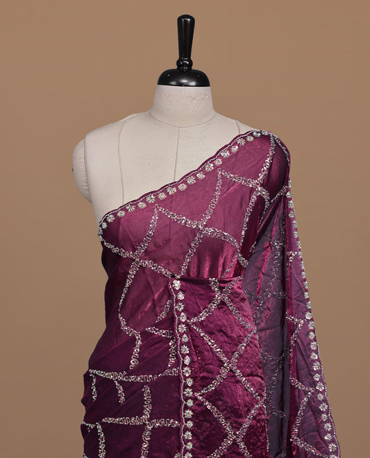 Burgundy colour designer saree featuring Sequins & cut beats worked body, cut beat worked border, paired with matching unstitched blouse.