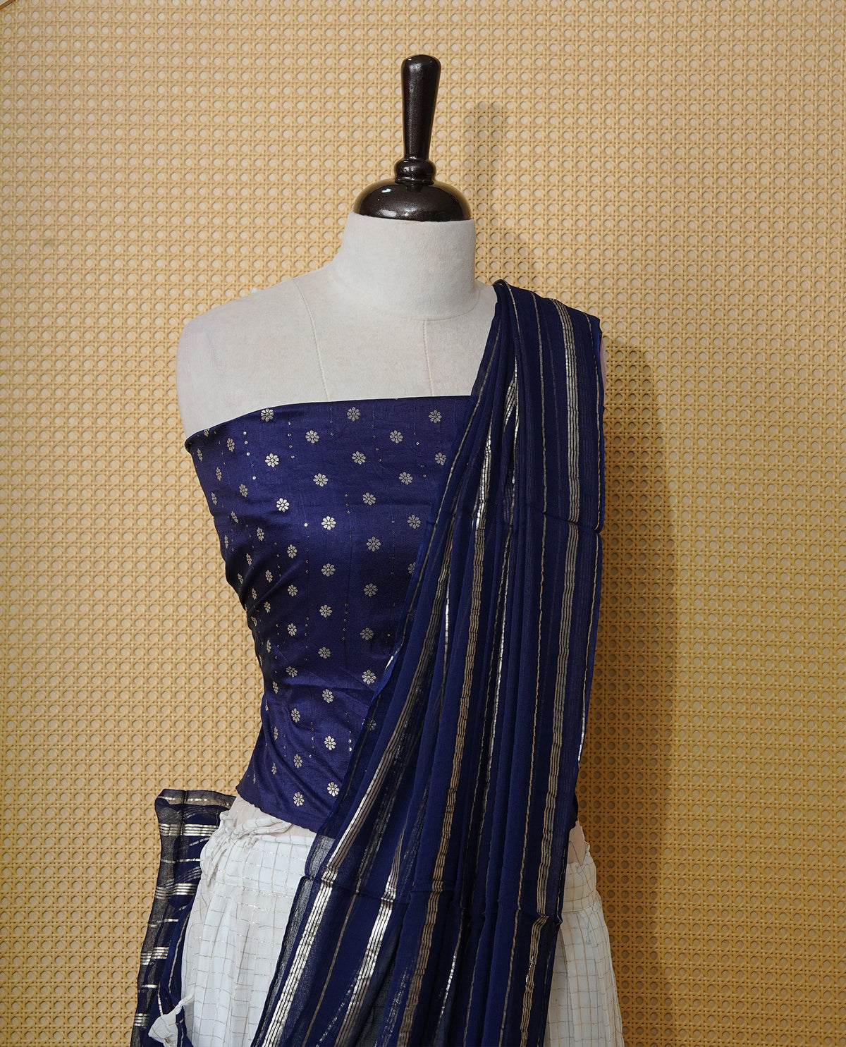 Off white colour Semi stitched dhavani set featuring Gold zari check pattern with contrast Navy blue border skirt, paired with matching blouse & dupatta.