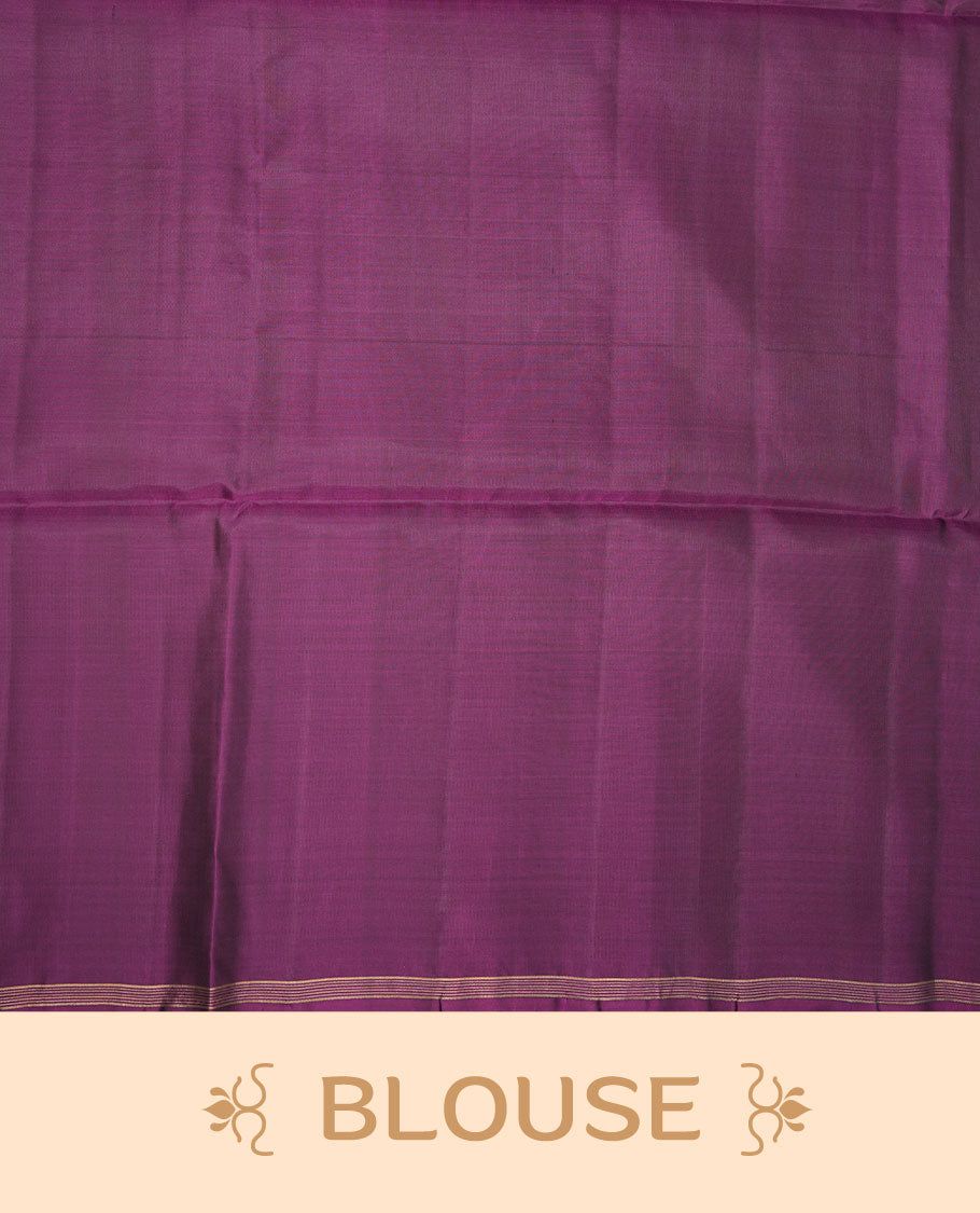 Purple colour soft silk saree featuring gold zari motifs on body, complemented by self colour with traditional  border with tassel at pallu, paired with matching blouse piece.