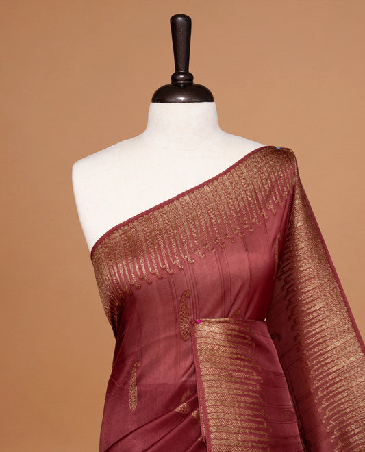 Burnt Umber colour Semi Banaras Tussar Georgette Featuring Gold zari Leaf pattern on body, Finished with Gold zari border and paired with matching blouse piece.