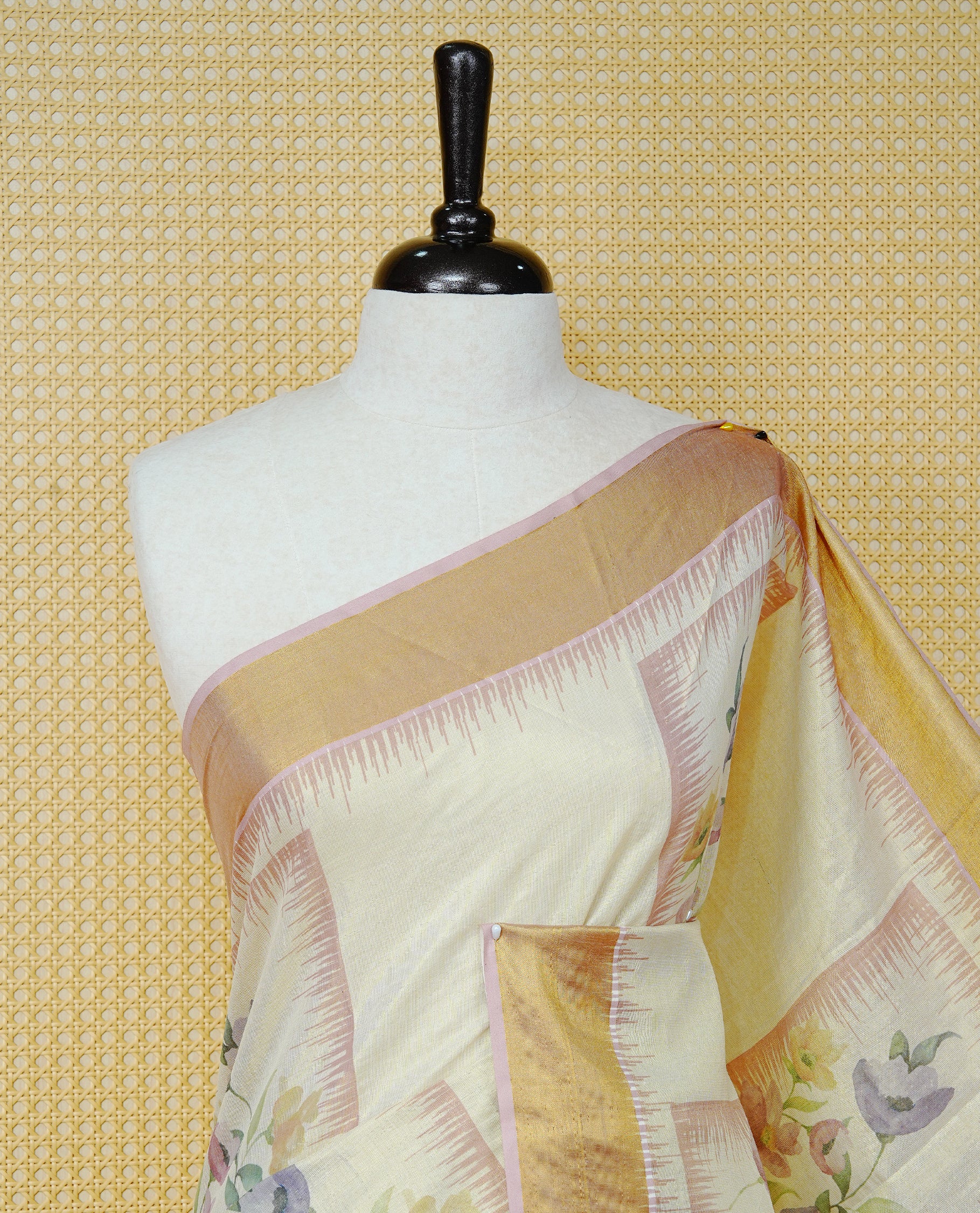 Cream Colour Tissue  Kerala Saree Featuring Floral Prints in a Stylish Rectangle Pattern On Body, Enhanced with a Gold Zari Border and a Multicoloured Striped Pallu. Finished with Elegant Tassels and Paired with a Matching Blouse Piece.