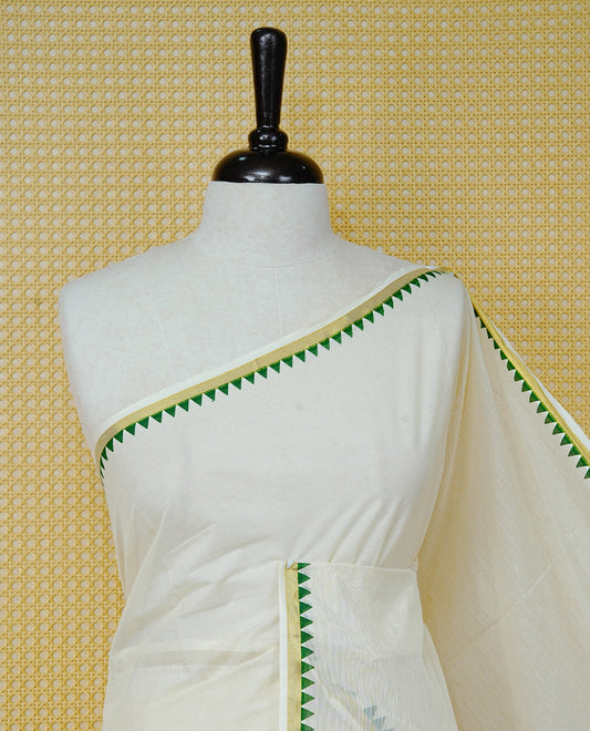 Cream  Colour cotton Kerala saree Featuring  with a gold zari border and green temple edging. Paired with a matching blouse piece.