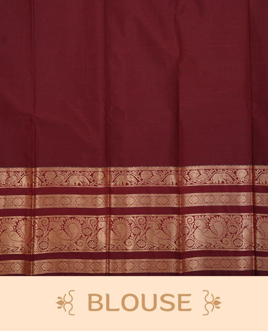 Burnt mustard colour soft silk sareee featuring gold zari Motifs on body, complemented by contrast Maroon colour with zari border, paired with matching blouse piece.