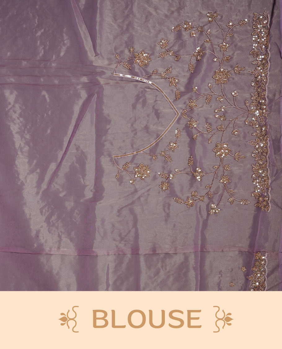 Pastel purple colour net organza saree featuring cut beats and sequins floral kodi pattern on body, enhanced with worked border and cut beats work on blouse piece.