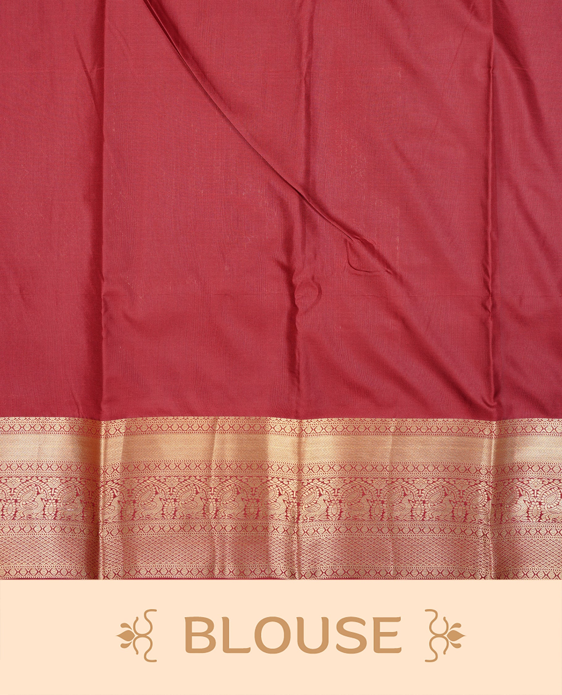 Maroon Colour Semi Wedding Silk Saree Featuring Gold Zari stripes With Chakkara & Peacock Buttas, Showcased with Green colour pipping With Traditional Border,  Paired With Matching Blouse Piece.