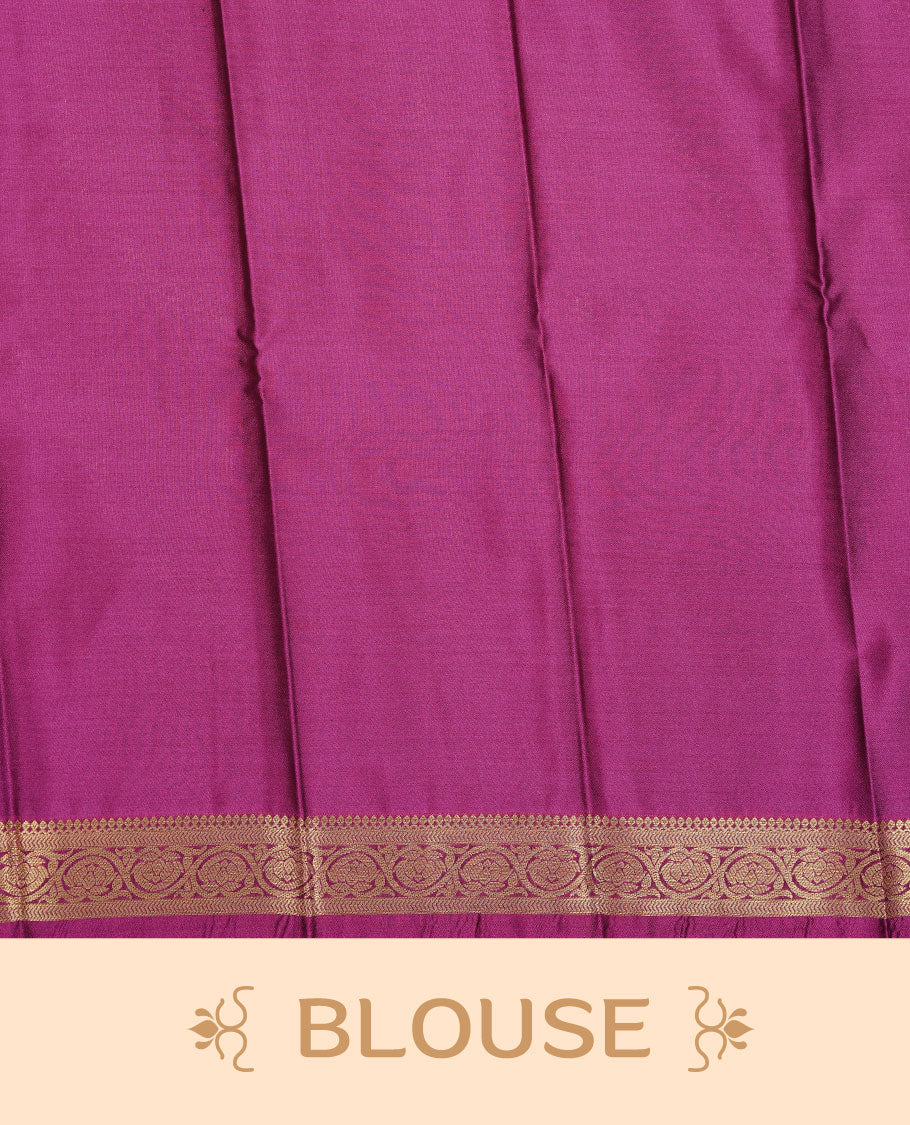 Teal colour soft silk saree featuring Gold zari  motifs on body, complemented by contrast Magenta colour with traditional border, paired with matching blouse piece.