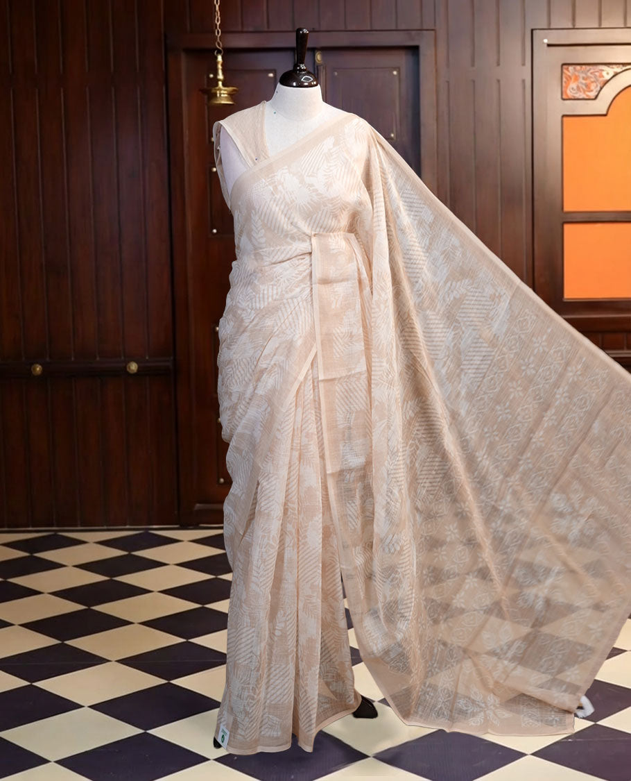 Off-white colour Soft linen material saree with subtle beige digital prints, finished with a minimal border and flowing pallu, paired with a matching blouse.