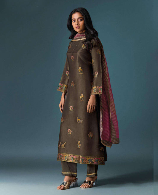 Brown colour suit material with Olivia silk jacquard top featuring elegant digital prints, paired with classic silk bottoms, and completed with a silk jari lining dupatta highlighted by digital prints