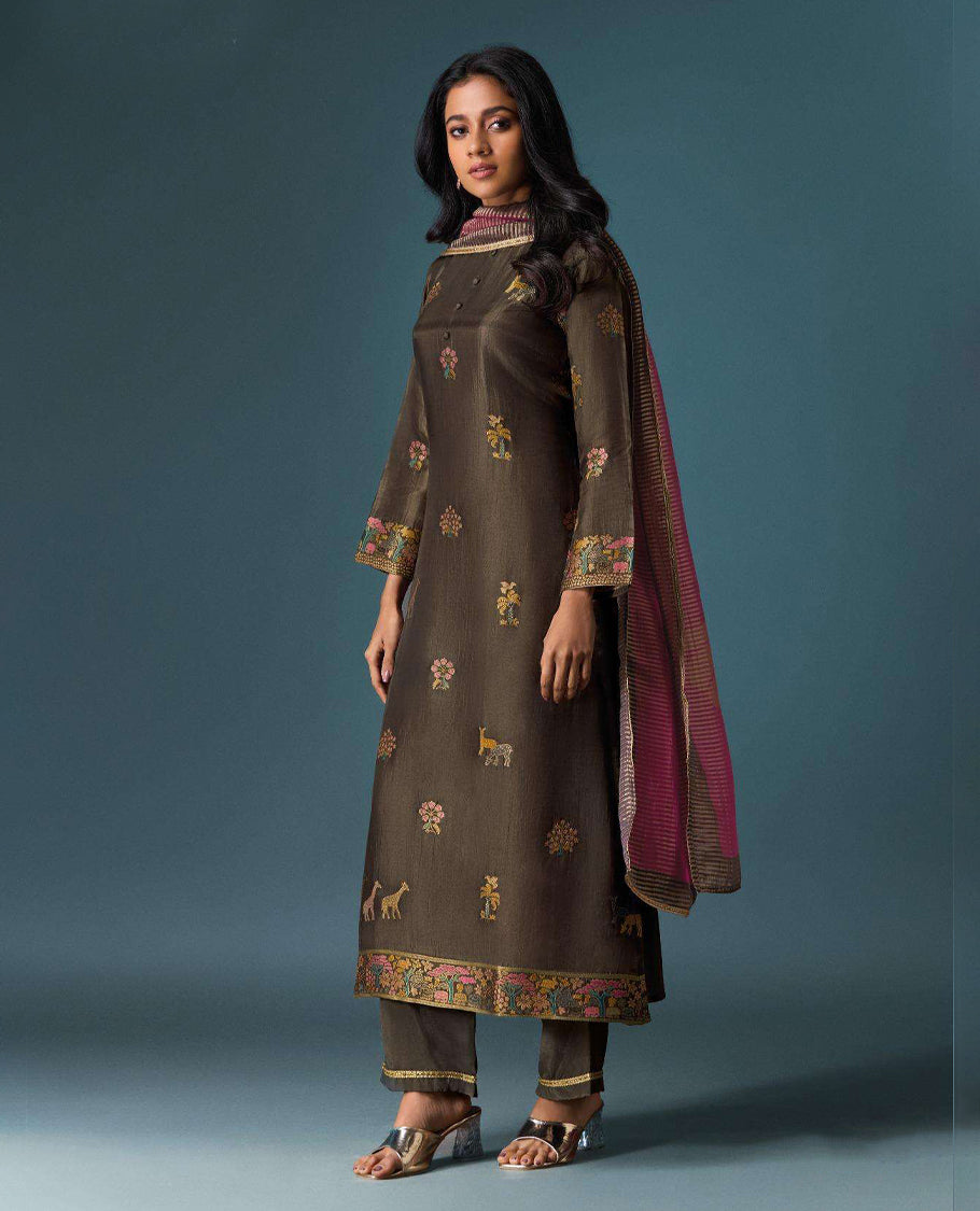 Brown colour suit material with Olivia silk jacquard top featuring elegant digital prints, paired with classic silk bottoms, and completed with a silk jari lining dupatta highlighted by digital prints