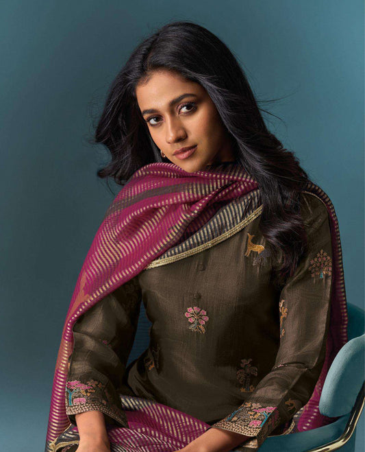 Brown colour suit material with Olivia silk jacquard top featuring elegant digital prints, paired with classic silk bottoms, and completed with a silk jari lining dupatta highlighted by digital prints