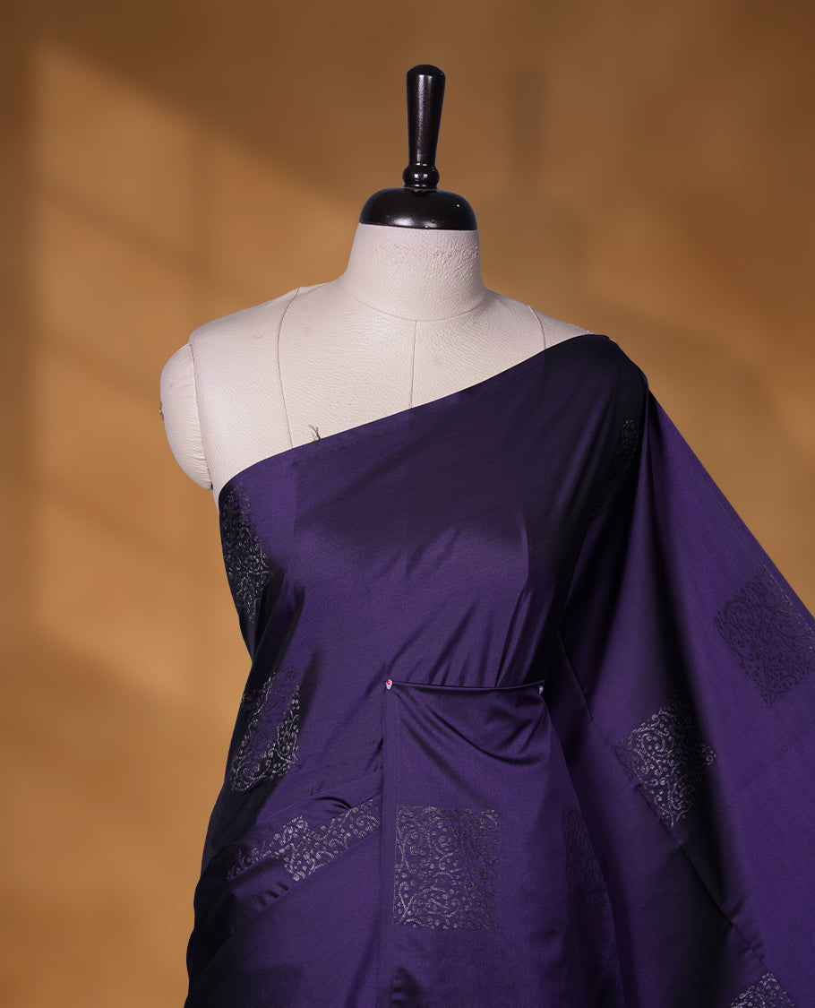 Dark purple colour soft silk saree featuring Antique zari motifs on body with Highlighting contrast Lavender colour pallu and paired with matching blouse piece.