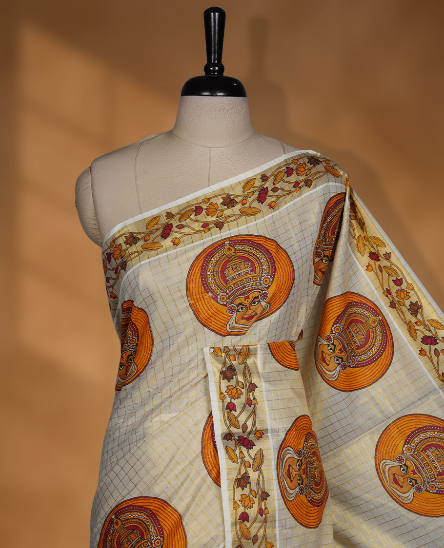 Light gold colour Tissue Kerala saree featuring a gold zari check pattern body, an intricately woven gold traditional border with floral and Indian art form print paired with a matching blouse.