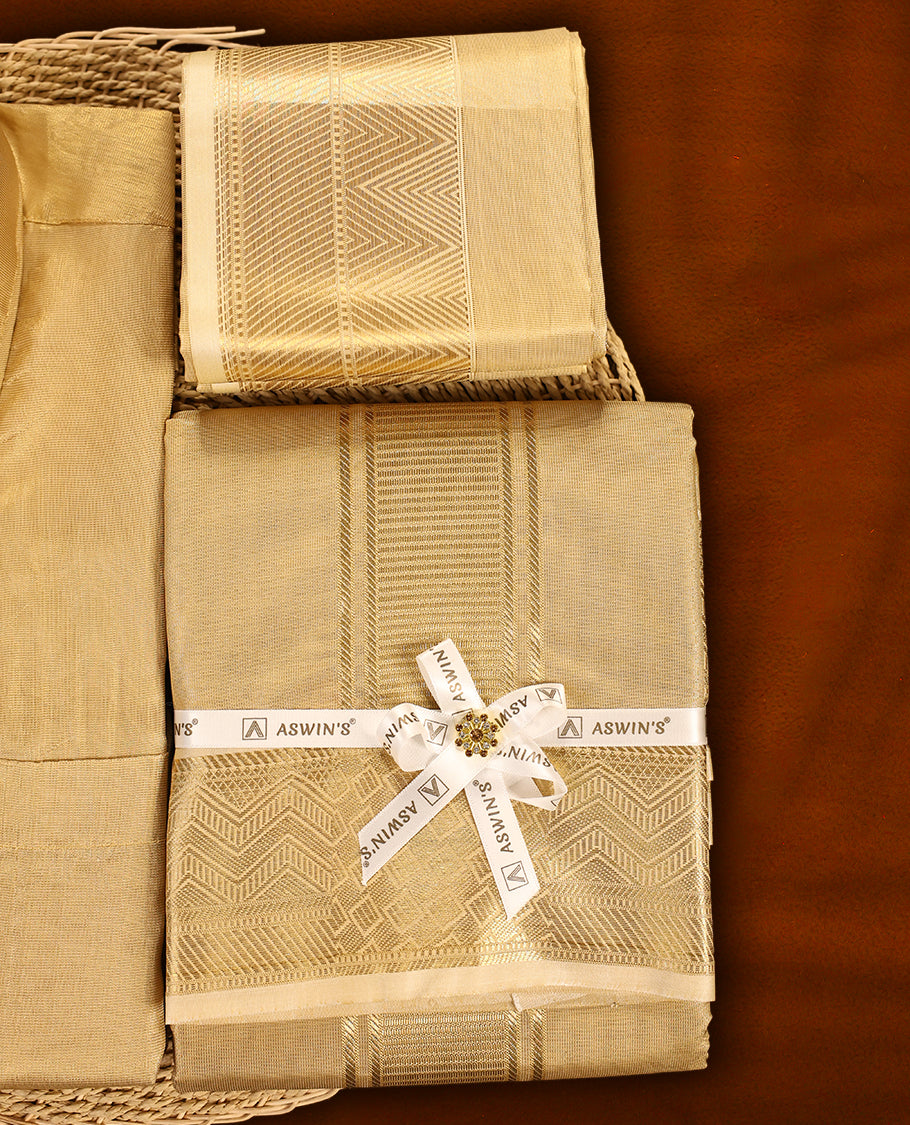 Biscuit colour Aswin’s wedding set featuring a rich silk shirt, matching dhoti, and angavastram adorned with elegant golden zari weave, complemented by a towel and fragrance, perfect for grand festive occasions.