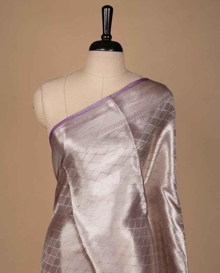 Lavender & silver double shade pure banaras tissue silk saree featuring silver zari pattern & stripes on body, complemented by silver zari traditional border, paired with matching blouse piece.