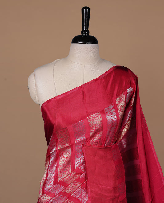 Rani pink colour banaras crepe saree featuring gold & silver zari design stripes on body, complemented by self colour border, paired with matching blouse piece.