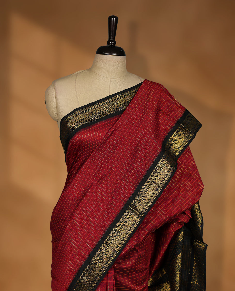 Maroon colour kalyani cotton saree featuring Antique zari check pattern on body, contrast Black colour border with antique zari pattern, paired with matching blouse piece.