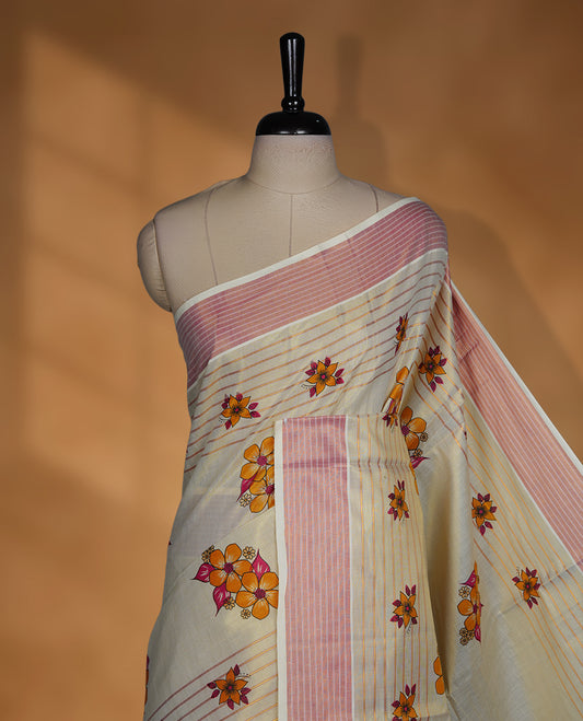 Light gold colour Tissue Kerala saree featuring a Plain body, an intricately woven gold and pink traditional border with floral print paired with a matching blouse.