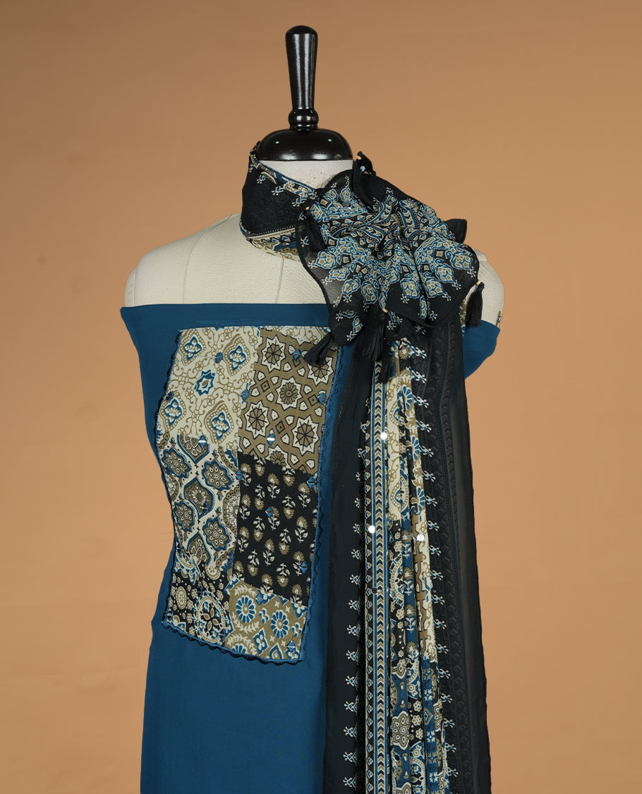 Blue colour georgette salwar suit collection featuring plain body enhanced with elegant black bunch kalamkari print on neck yoke, detailed with subtle mirror work , paired with kalamkari printed dupatta with mirror work with santon material bottom.