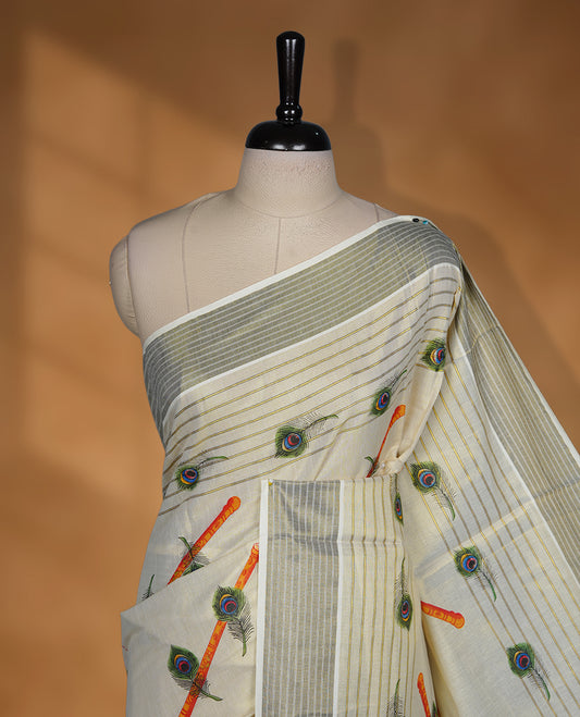 Light gold colour Tissue Kerala saree featuring a Plain body, an intricately woven gold and black traditional border and stripes and peacock leaf pattern on pallu, paired with a matching blouse.