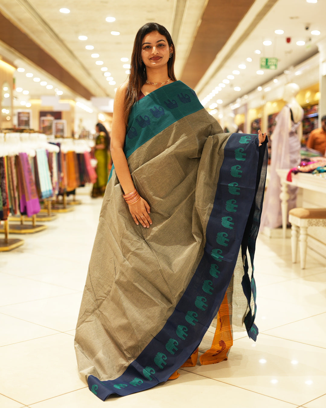 Navy Blue with Peacock green Bengal cotton saree featuring Ganga Jamuna Style Contrast Border with elephant motifs, Striped pallu.