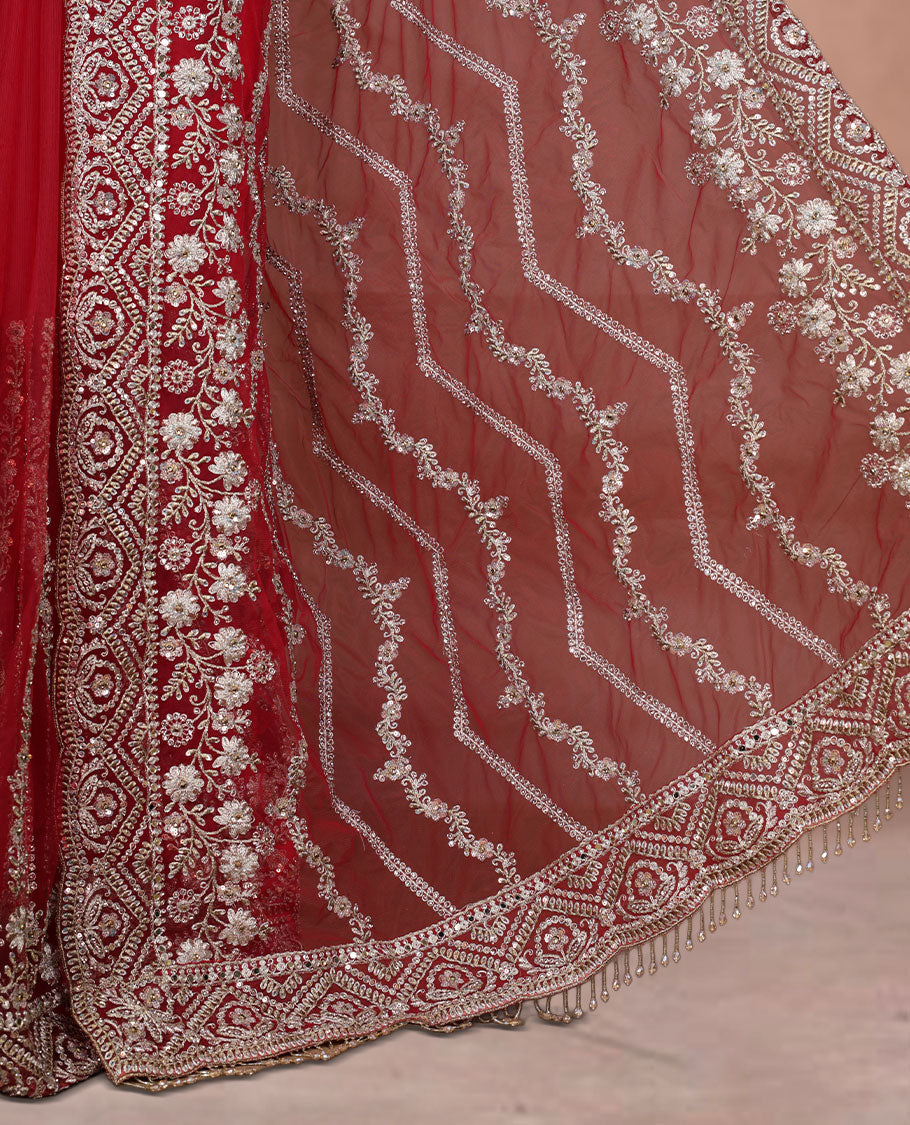 Red Colour net designer Wedding saree featuring all over floral embroidery with sequin detailing and an ornate scalloped border, finished with a matching embellished blouse.