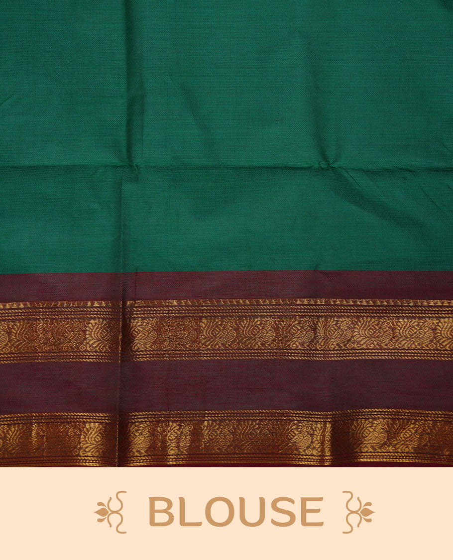 Dark green colour chettinad cotton saree featuring elegant plain body highlighting contrast maroon colour colour with gold zari traditional border, pallu and paired with matching blouse piece.