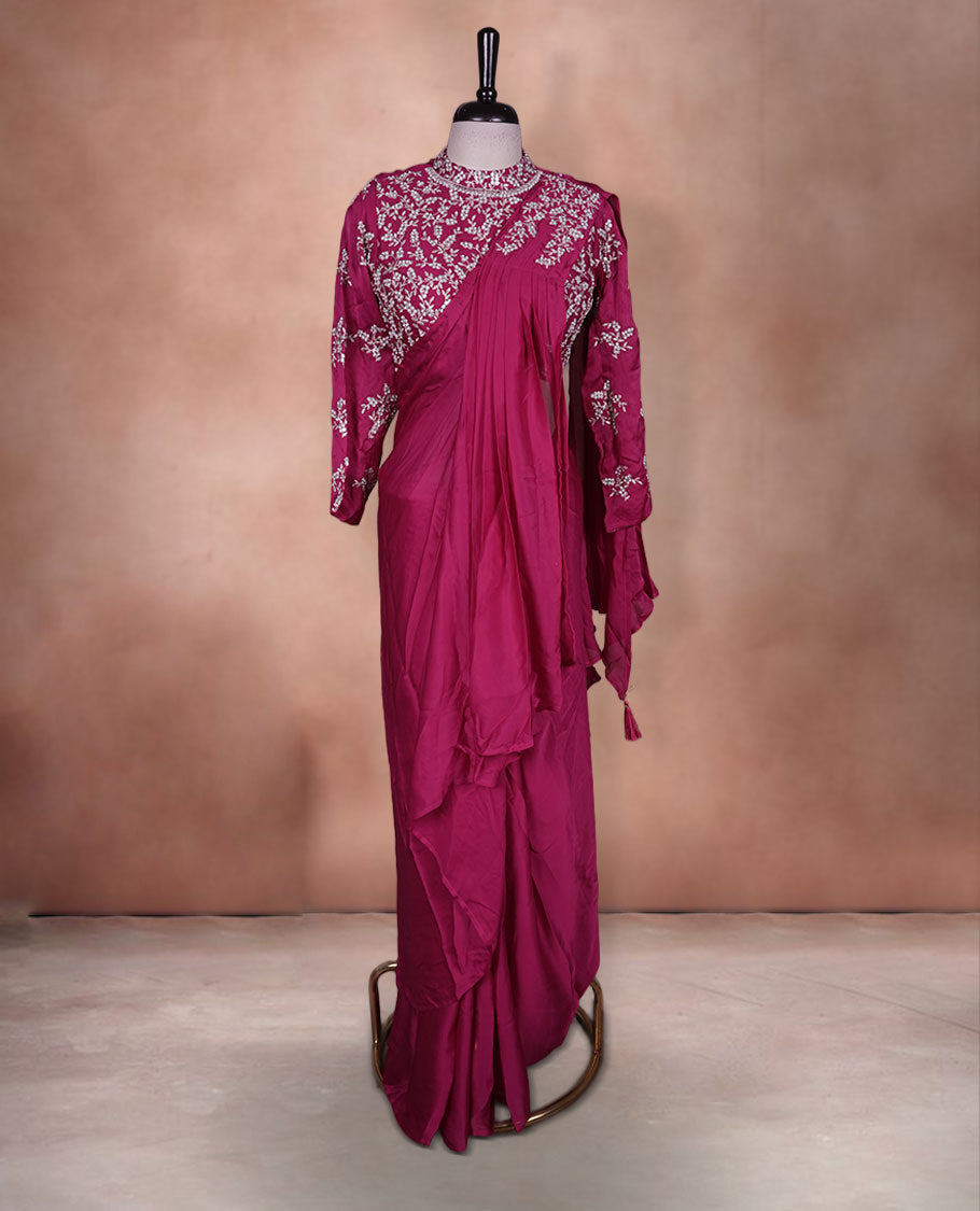 Rani pink colour ready to wear saree Fearturing intricate silver embroidery on the pallu, paired with a beats and thread embroidered matching blouse.