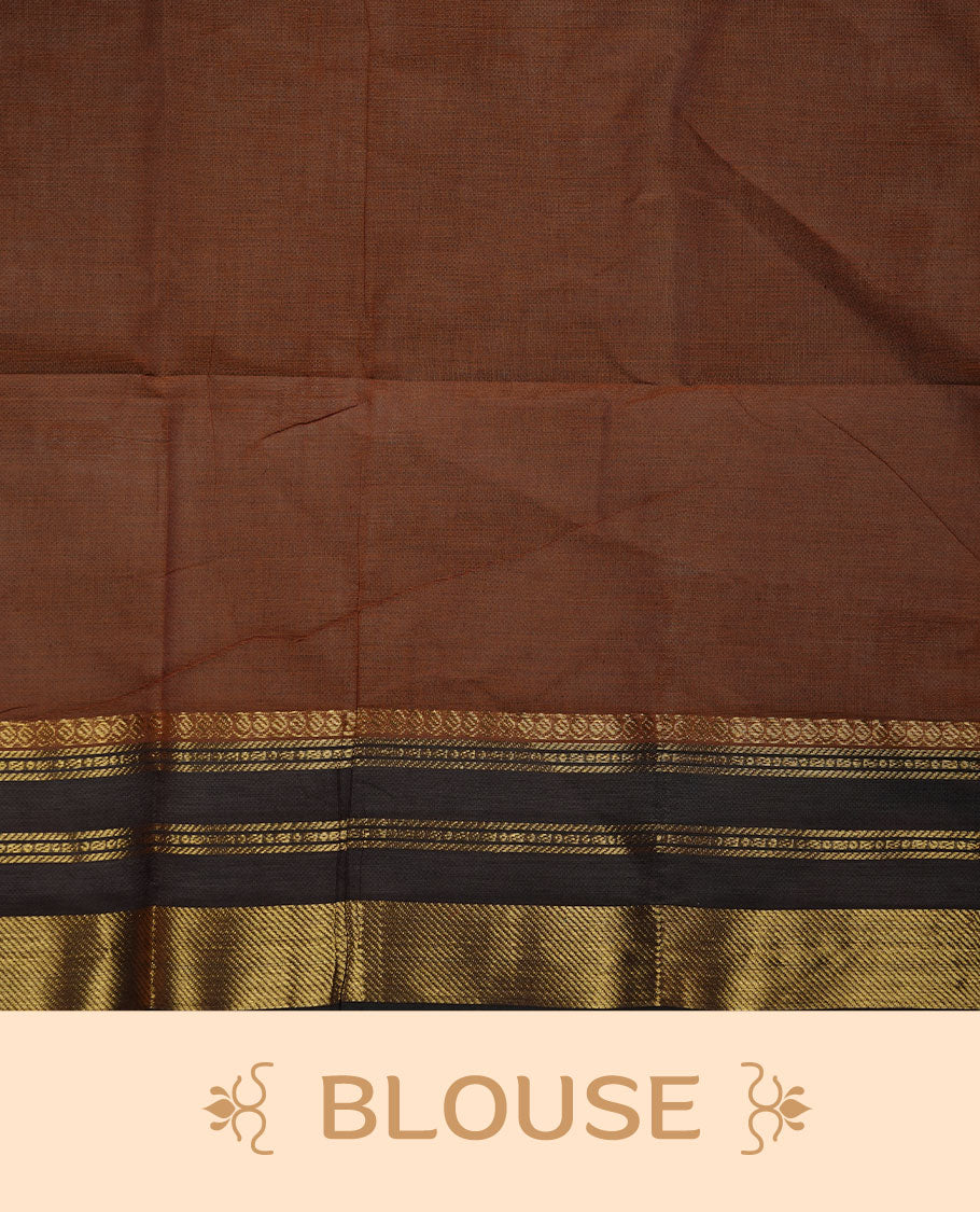 Brown colour chettinad cotton saree featuring small gold zari buttas on body highlighting contrast dark chocolate colour with gold zari traditional border, pallu and paired with matching blouse piece.