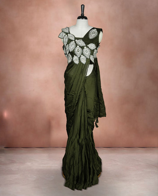 Dark olive colour ready to wear saree featuring bold silver applique embroidery on the drape, paired with a sculpted matching blouse