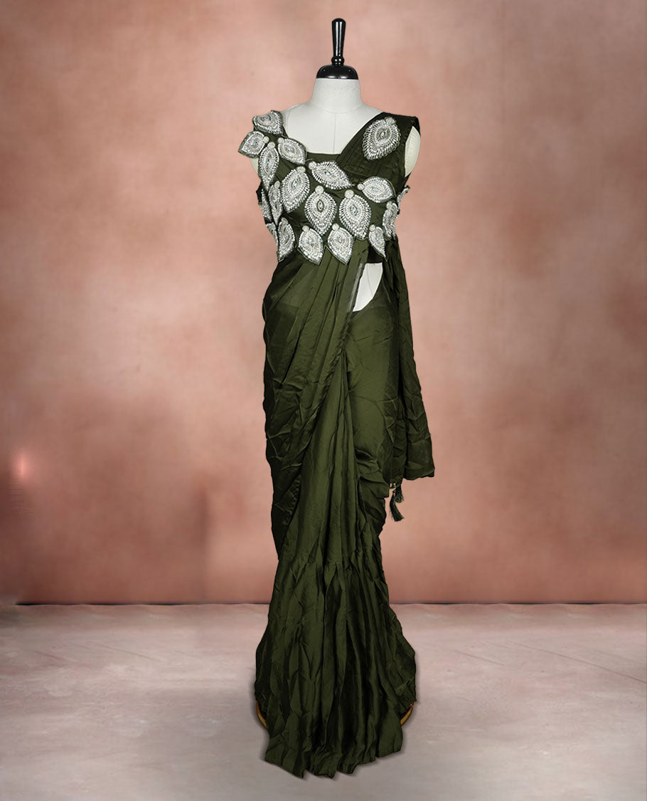 Dark olive colour ready to wear saree featuring bold silver applique embroidery on the drape, paired with a sculpted matching blouse