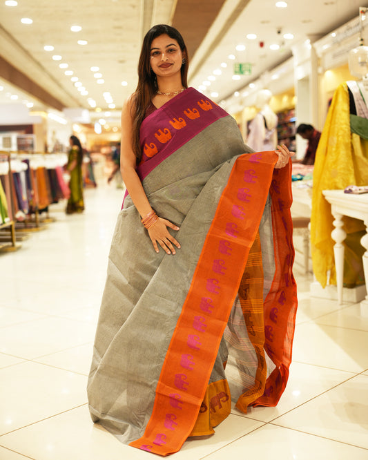Pink with Orange Bengal cotton saree featuring Ganga Jamuna Style Contrast Border with elephant motifs, Striped pallu.
