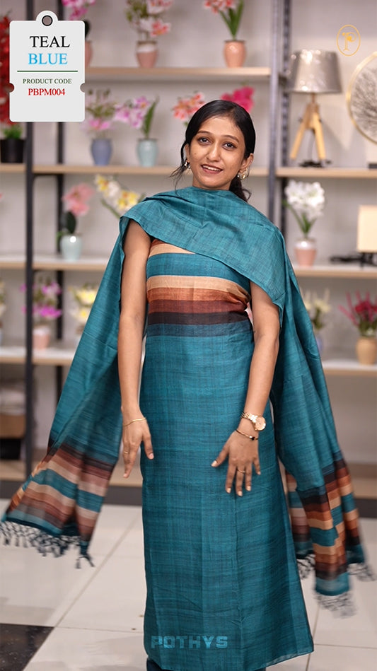 Teal blue colour semi tussar silk salwar material featuring elegant horizontal stripes on the yoke and dupatta, woven in shades of beige and black & Paired with a matching plain bottom.