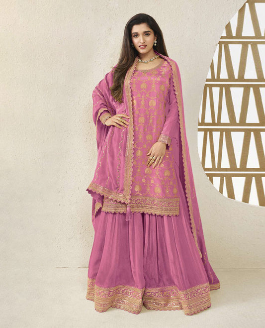 Dusty Pink colour semi stitched salwar suit featuring an embroidered chinon top material paired with a matching sharara  bottom, and dupatta.