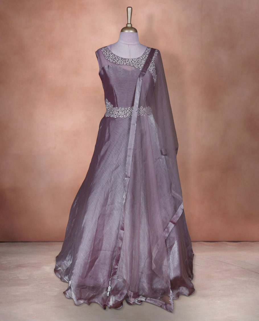 Dusty mauve colour stitched gown set with sleeveless embellished yoke, sheer studded back, flared layered hem with scalloped edge, and matching plain sheer dupatta.