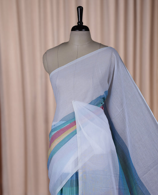 White colour soft cotton saree with rainbow colored horizontal lines on the body, a vibrant multicolor pallu, and a subtle border & Elegant and lightweight, this saree comes without a blouse piece for a customizable style.