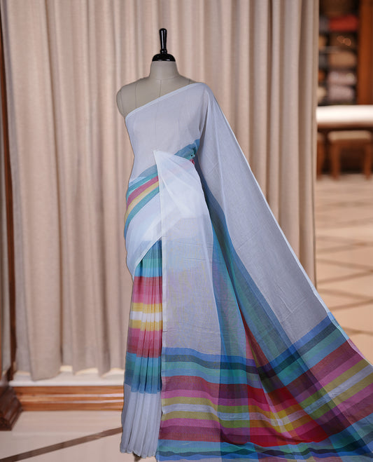 White colour soft cotton saree with rainbow colored horizontal lines on the body, a vibrant multicolor pallu, and a subtle border & Elegant and lightweight, this saree comes without a blouse piece for a customizable style.